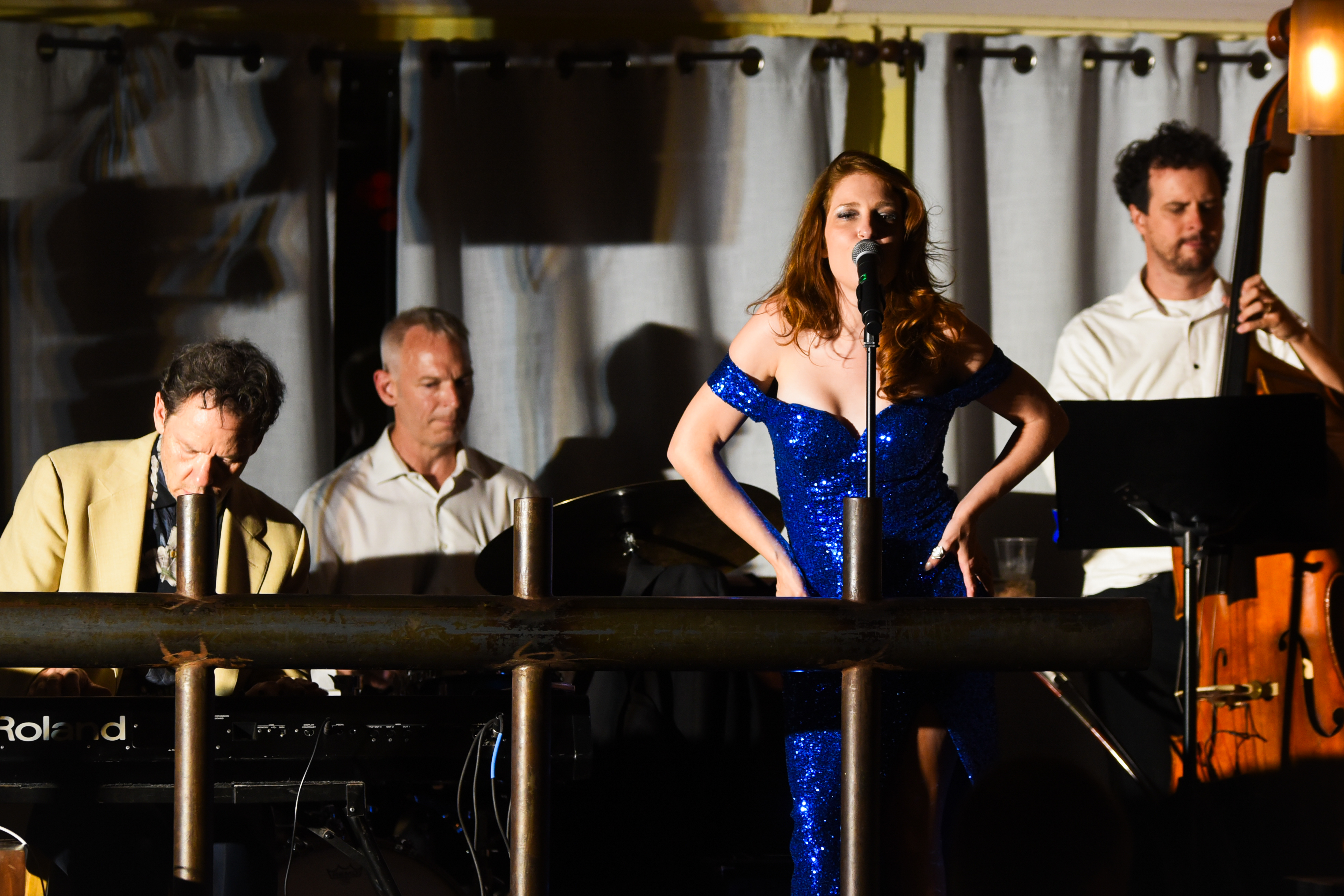 Vocalist performing live with band at Café 333